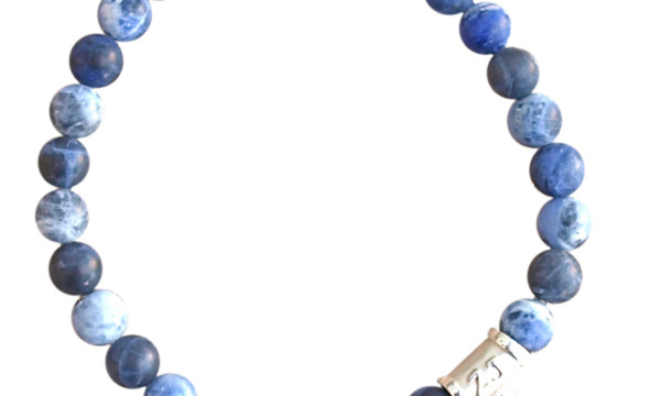 Sodalite bracelet adorned with a sterling silver karma charm by zen jewelz