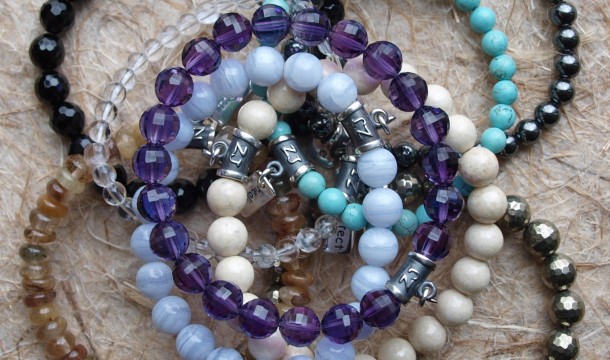 Assorted healing crystal bracelets made with natural gemstones by zen jewelz