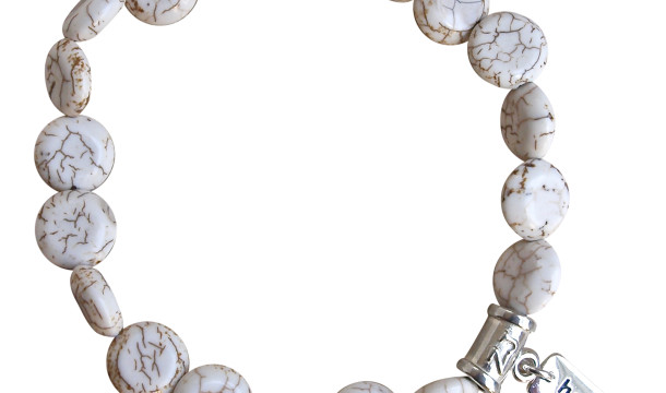 White Turquoise bracelet adorned with a sterling silver healing charm by zen jewelz