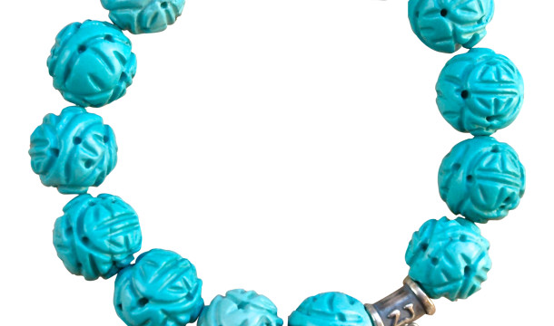 Carved Turquoise gemstone bracelet adorned with a sterling silver heart and peace charm - turquoise healing properties