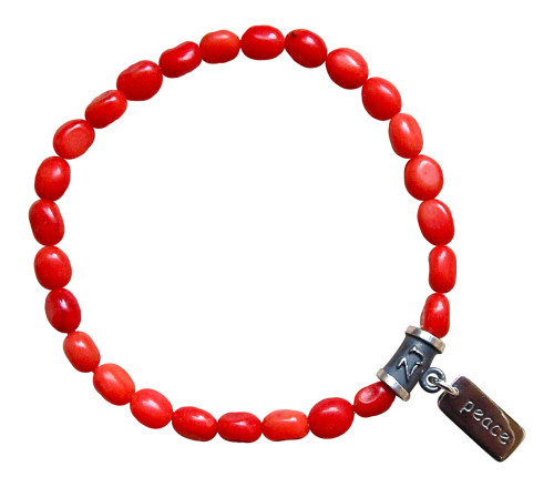 Red Coral gemstone bracelet adorned with a sterling silver peace charm by zen jewelz - red coral meaning