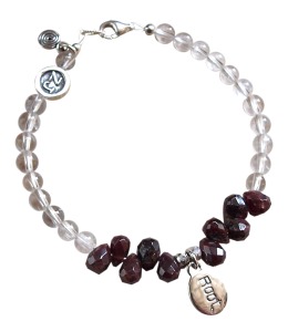 Garnet and clear Quartz Chakra Stones bracelet adorned with a sterling silver root chakra charm - chakra stones