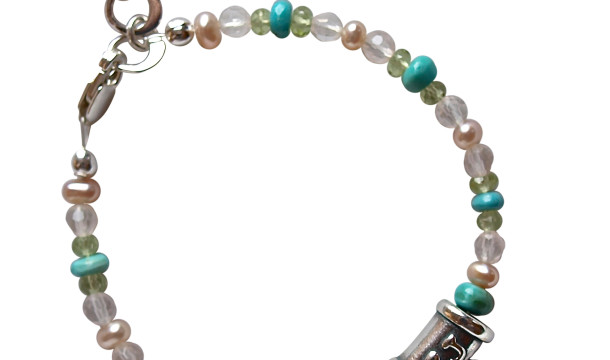 Baby Bracelet made with assorted gemstones adorned with a sterling silver heart charm with a baby hand print